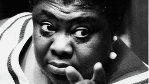 Photo of Elma Lewis pointing off camera.