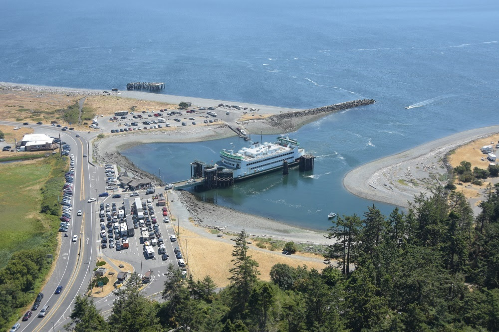 Aerial view of Keystone Harbor and Coupeville terminal with ferry at dock and vehicles in holding lanes