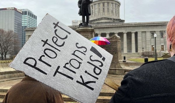 Demonstrators advocating for transgender rights and healthcare stand outside of the Ohio Statehouse, Jan. 24, 2024, in Columbus, Ohio. A federal appeals court on Wednesday, July 17, refused to lift a judge&#x27;s order temporarily blocking the Biden administration’s new Title IX rule meant to expand protections for LGBTQ+ students. (AP Photo/Patrick Orsagos, File)