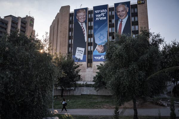 An Israeli election poster in Jerusalem showing Benjamin Netanyahu shaking hands with Donald Trump.  