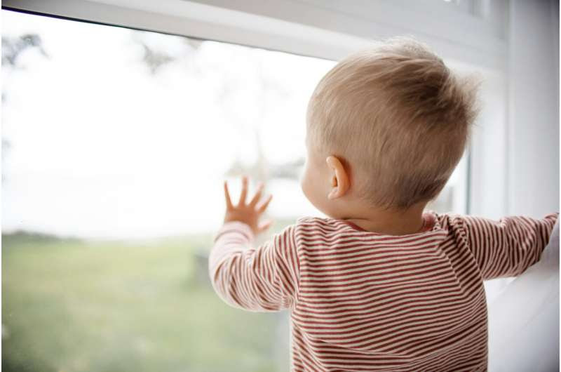 child at window