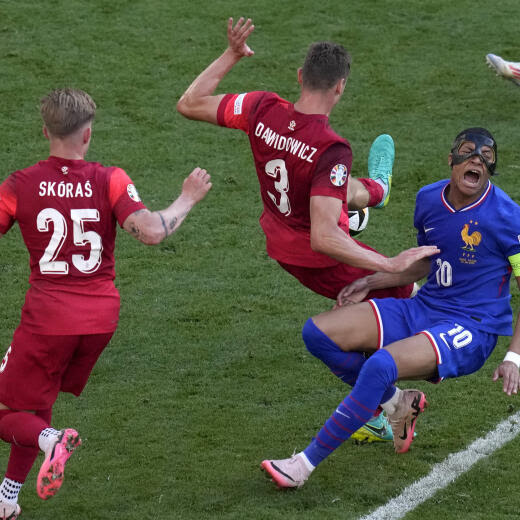 Kylian Mbappe of France falls with Poland's Pawel Dawidowicz during a Group D match between the France and Poland at the Euro 2024 soccer tournament in Dortmund, Germany, Tuesday, June 25, 2024. (AP Photo/Themba Hadebe)