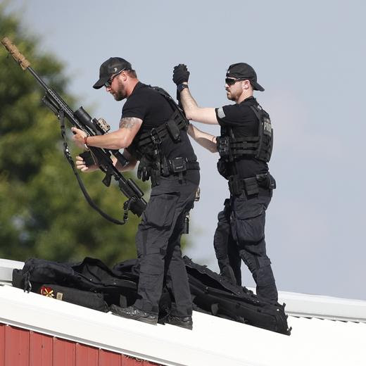 epa11476851 Law enforcement snipers set up before the arrival of former president Trump on a rooftop overlooking a campaign rally at the Butler Farm Show Inc. in Butler, Pennsylvania, USA, 13 July 2024. During the campaign rally Trump was rushed off stage by secret service after a shooting. Former US President Donald Trump stated on social media that a bullet pierced the upper part of his right ear and that a person attending the rally was killed, another was injured and that the alleged shooter was dead. EPA/DAVID MAXWELL