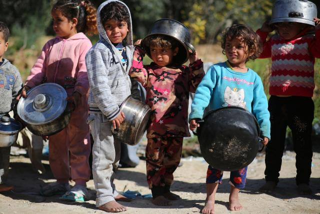 Children using pots and pans as armour