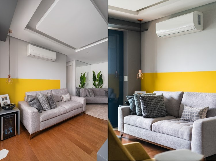 Quebrando os tons neutros do living com uma pintura amarela em formato retangular, a parede desse apartamento ganhou um ar mais moderno e divertido, possuindo um projeto baseado no Feng Shui. A própria cor amarela possui propriedades estimulantes, proporcionando alegria ao ambiente de descontração e descompressão que é o living. | Projeto: Spaço Interior | FOTO: Kadu Lopes