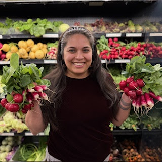 Staff Member with Radish Bunches