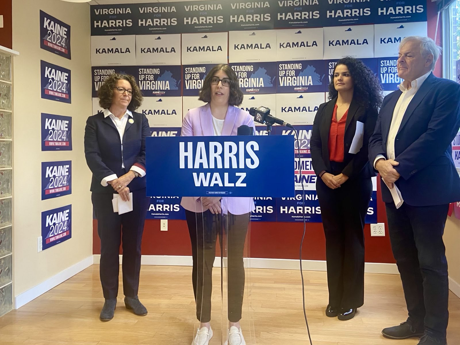 Amy Laufer, Mara Shapiro, Katrina Callsen, and David Toscano standing at podium