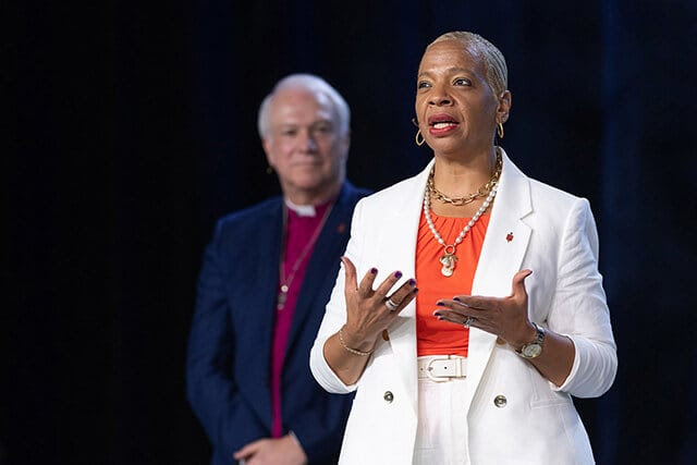 Bishop Tracy S. Malone addresses the 2024 United Methodist General Conference in Charlotte, N.C., after taking over as president of the denomination’s Council of Bishops from outgoing council president Bishop Thomas Bickerton (rear). The Council of Bishops is calling for a five-day leadership gathering in April or May 2026. The bishops plan to hold the gathering instead of the special session of General Conference that they previously announced. Photo by Mike DuBose, UM News. 