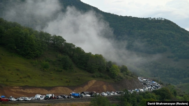 Nagorno-Karabakh - Vehicles carrying refugees from Nagorno-Karabakh queue on the road leading towards the Armenian border, September 25, 2023.