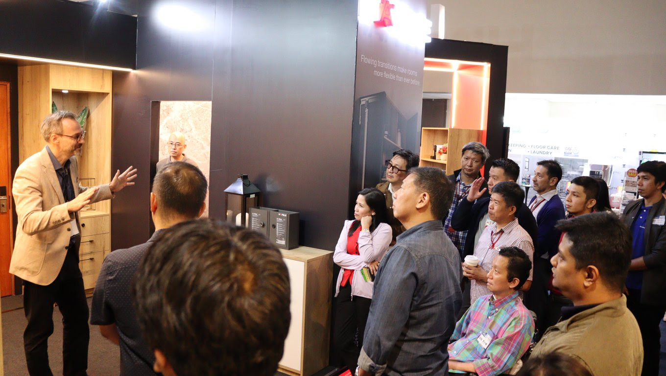 HPI Managing Director, Roland Poehlmann conducts booth tour