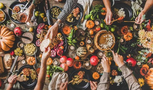 Make this Thanksgiving feel special, even with a smaller crowd. Cozy dinners and new traditions can help usher in happiness. Photo credit: Depositphotos.