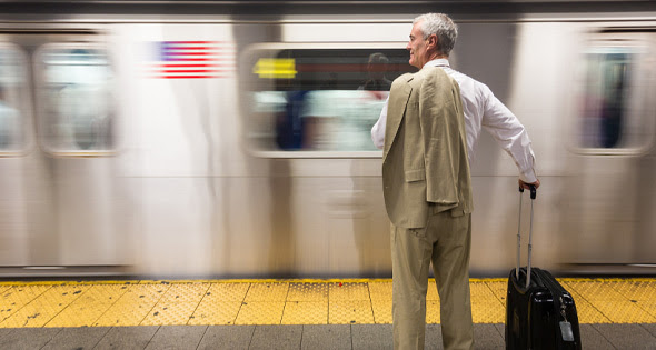 Older man waiting for the subway. 