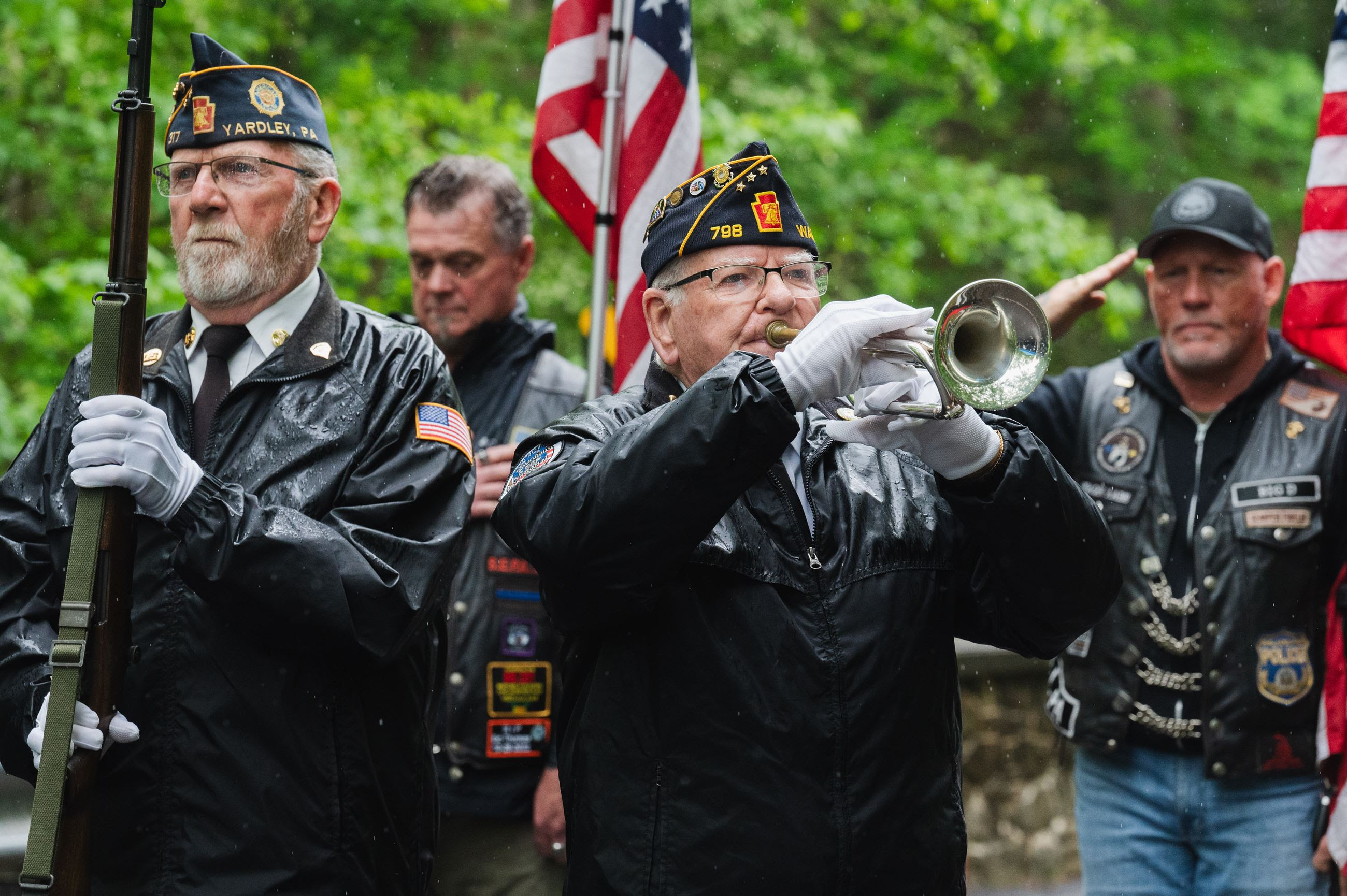 A man playing a bugle during a ceremony.