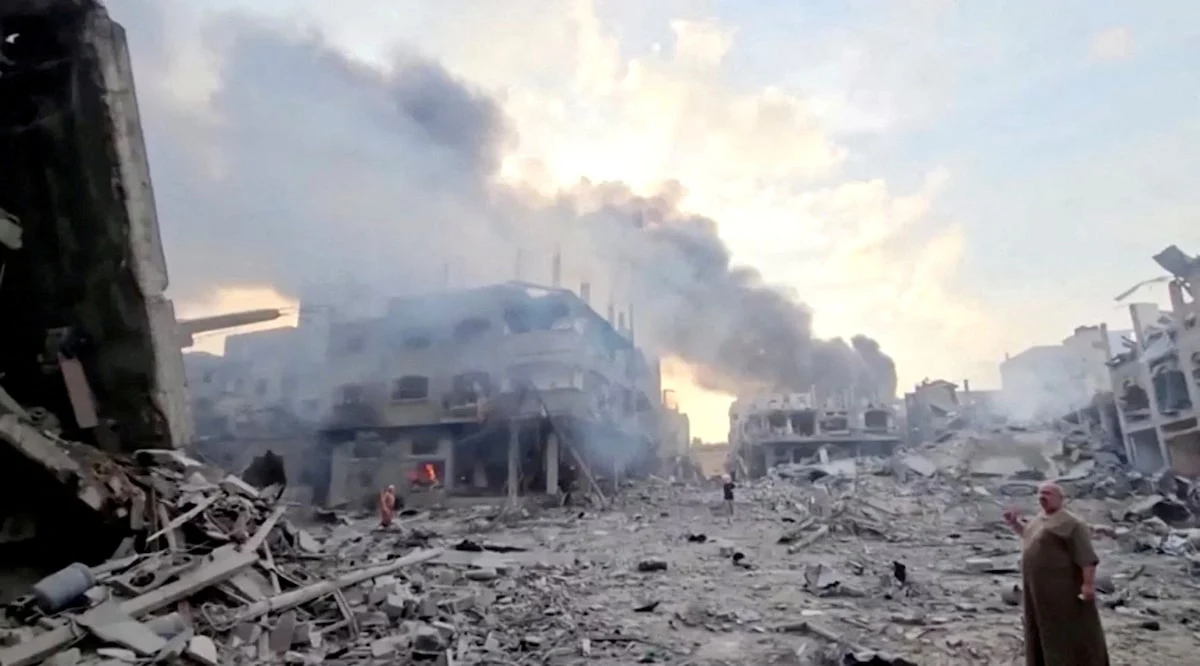 People survey the destruction at Gaza's Jabalia refugee camp