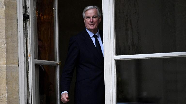 (FILES) French Prime Minister Michel Barnier looks on as guests leave after a meeting between French Prime Minister and parliamentary group leaders at the Hotel Matignon in Paris on November 26, 2024. French Prime Minister faces the biggest risk yet of being deposed by a hostile National Assembly as his government on December 2, 2024 presents a social security financing plan that has the opposition up in arms. (Photo by JULIEN DE ROSA / AFP)