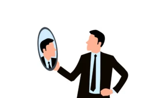 businessman looking in the mirror