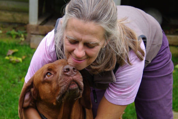 photo of woman and dog