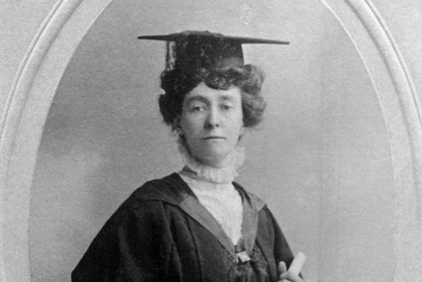 Emily Wilding Davison wears a graduate cap and holds a degree scroll