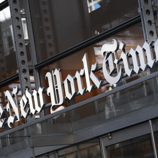 FILE - A sign for The New York Times hangs above the entrance to its building, Thursday, May 6, 2021 in New York. The New York Times moved swiftly to change the word fetus, Monday's answer to its daily Wordle puzzle, out of fear that it would be seen as some sort of commentary on the debate over abortion rights. The game, which became a sensation late last year and was bought by The Times in January, gives users six tries to guess a different five-letter word each day. (AP Photo/Mark Lennihan, File)