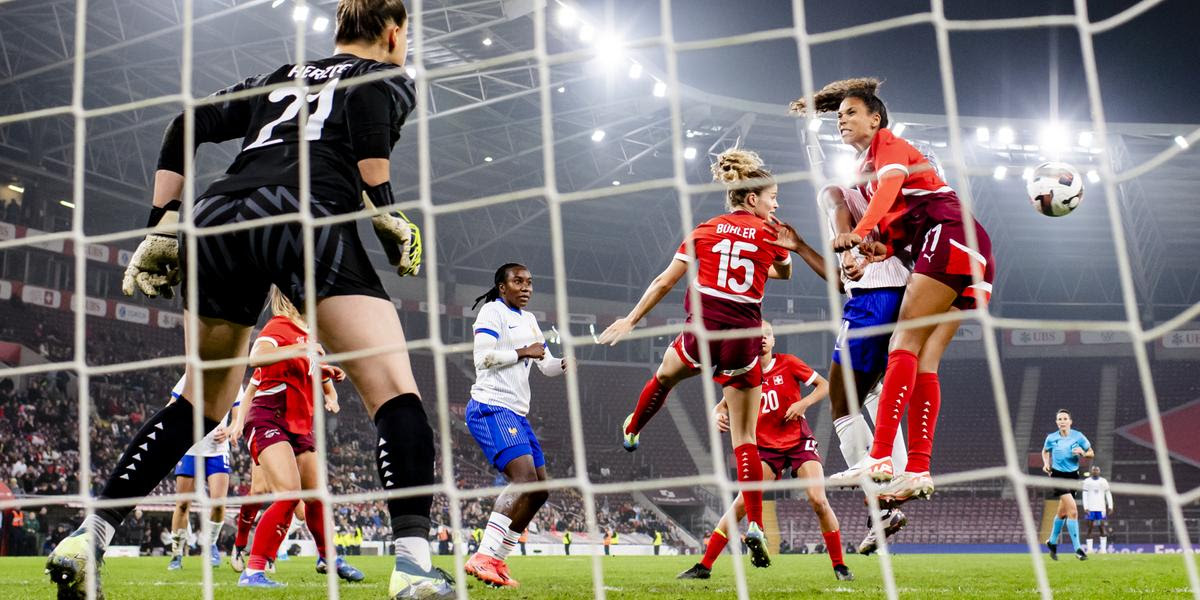 Switzerland's goalkeeper Elvira Herzog, left, Switzerland's defender Luana Buehler, center, Switzerland's midfielder Coumba Sow, right, in action during the women's international friendly soccer match between Switzerland and France at the Stade de Geneve stadium, in Geneva, Switzerland, Tuesday, October 29, 2024. (KEYSTONE/Jean-Christophe Bott)