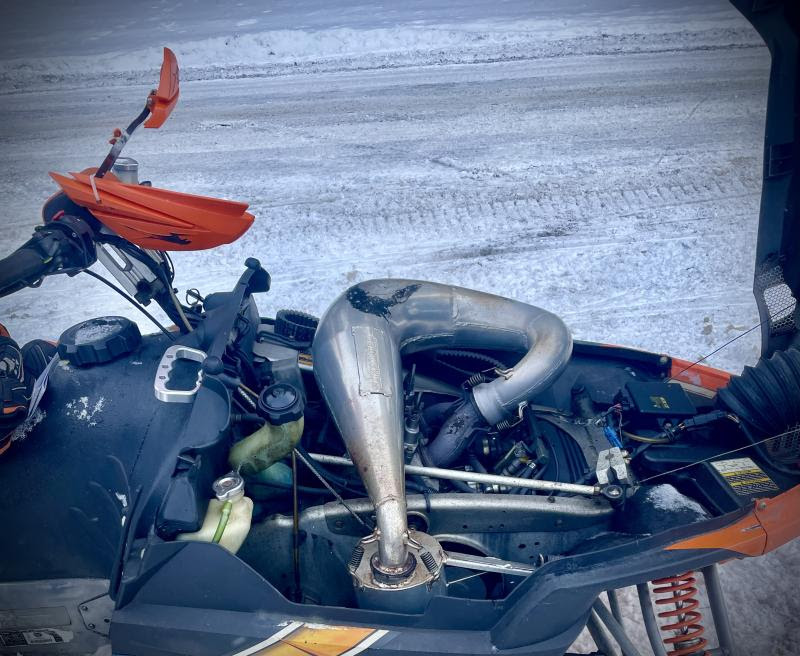 Modified exhaust on a snowmobile