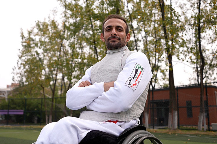 Ammar Ali poses to the camera with the arms crossed.