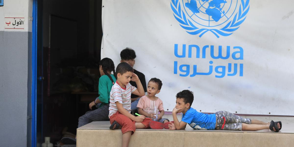 FILE - Palestinian children who fled with their parents from their houses in the Palestinian refugee camp of Ein el-Hilweh, gather in the backyard of an UNRWA school, in Sidon, Lebanon, Sept. 12, 2023. (AP Photo/Mohammed Zaatari, File)