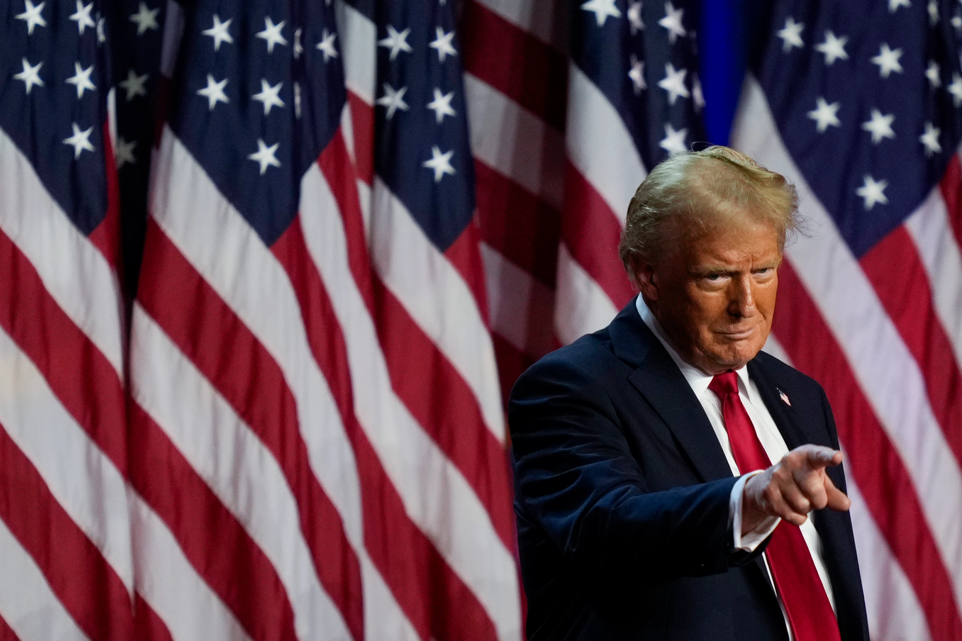 President-elect Donald Trump points to the crowd at an election night watch party on Wednesday.