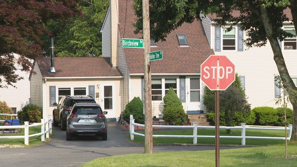 Cranston man critically injured after being pinned under car