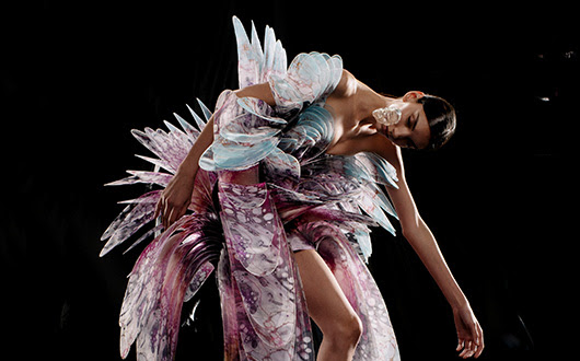 Model posing in the Iris Van Herpen exhibition