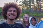 Amin Neal takes a selfie with Dr. Carol Price (middle), and fellow CMAST student Iileyah Braxton (right) in a wetland