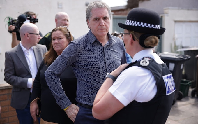 Steve Rotheram, the mayor of Liverpool, speaks to Serena Kennedy, the Merseyside Police Chief Constable, in Southport on Wednesday