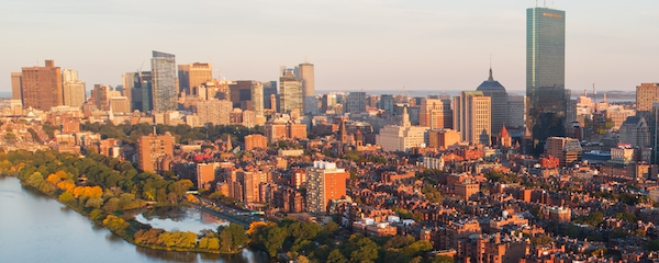 a skyline view of boston with the charles river on the left