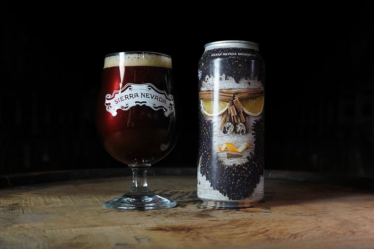 A full glass and can of Spiced Barrel-Aged Bigfoot