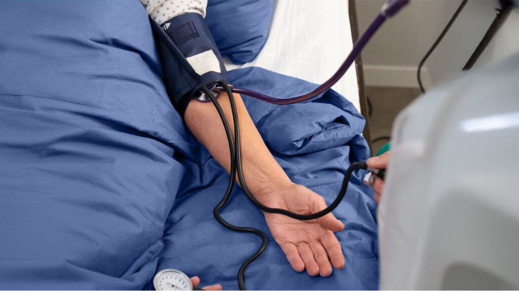 Person's arm with a blood pressure cuff