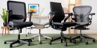 Four distinctly designed ergonomic chairs lined up side by side, showcasing diverse styles and functionalities