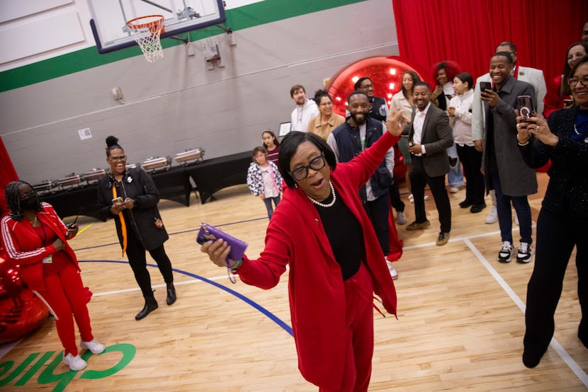 Cynt Marshall, chief executive officer of the Dallas Mavericks, dances to “Ain't No Mountain...