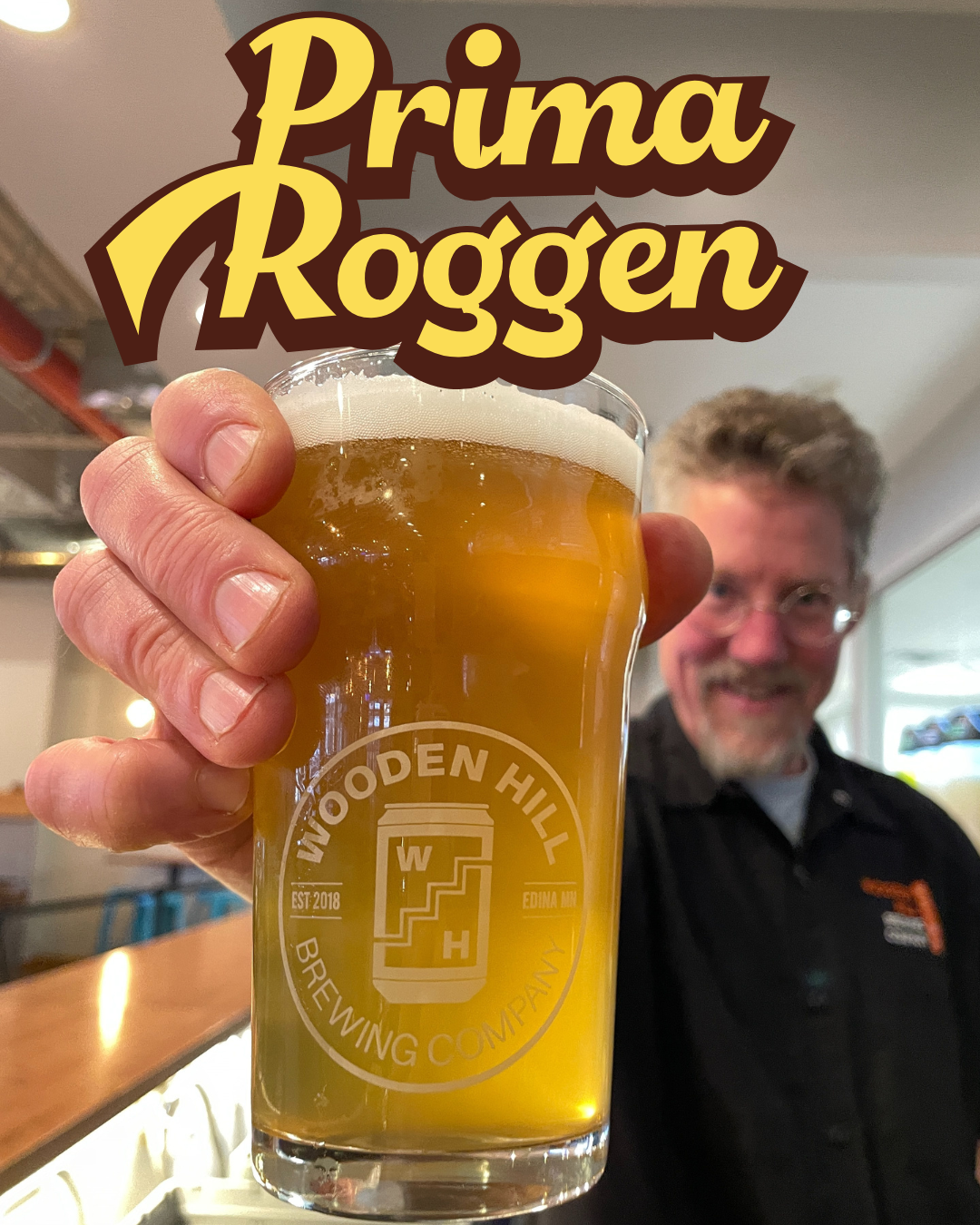 graphic of guy holding up a light beer in a Wooden hill pub glass. States: Prima Roggen