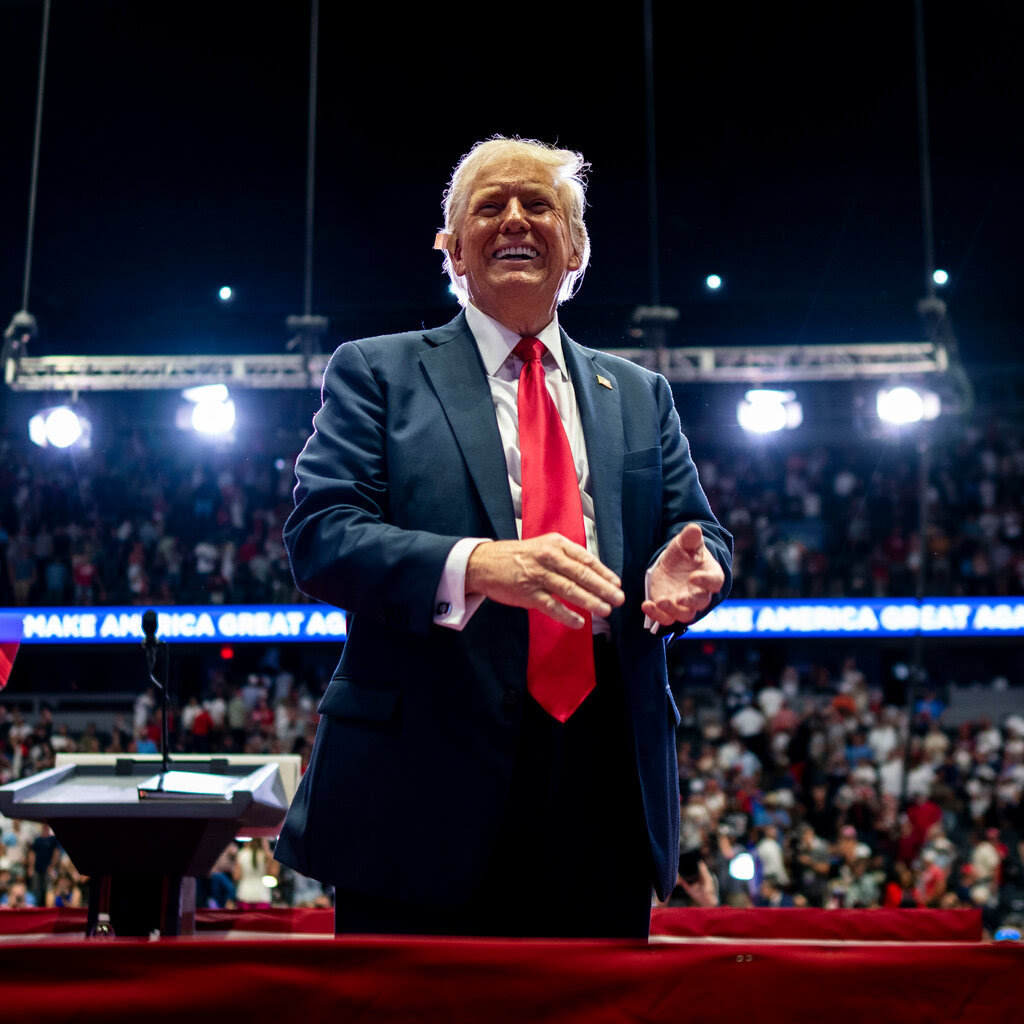 Donald Trump smiling onstage.