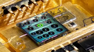 Optical Image of a Fully Packaged Hybrid Integrated Erbium Laser Based on Silicon Nitride Photonic Integrated Circuit