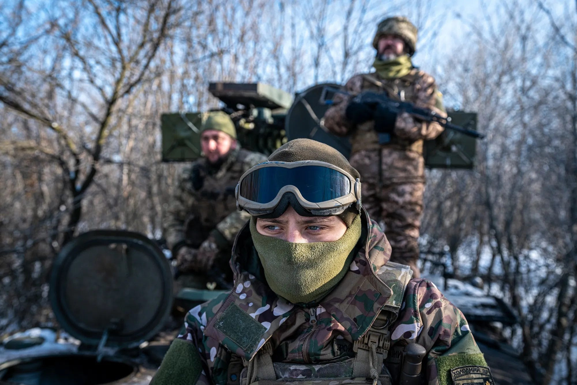 Ukrainian soldiers by an anti-aircraft vehicle towards its position at the Bakhmut frontline, in Donetsk Oblast.