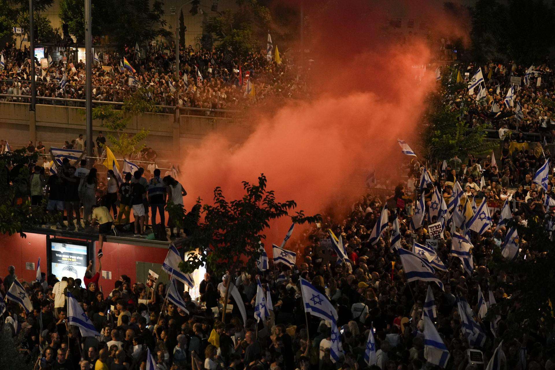 People take part in a protest in Tel Aviv, Israel, on Sunday. 