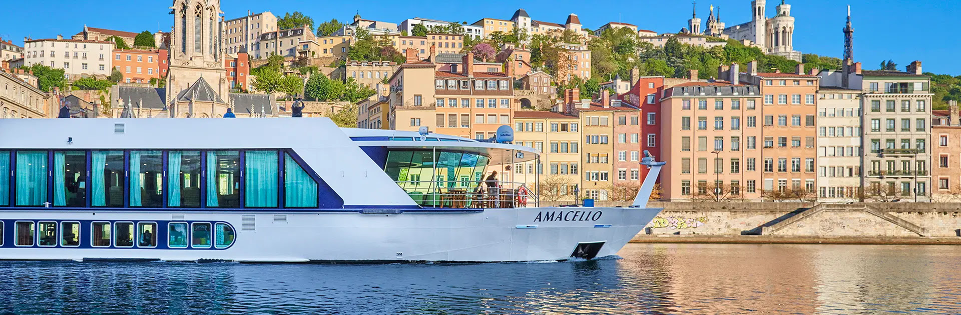 Real photo of the AmaCello gliding past historic European architecture.