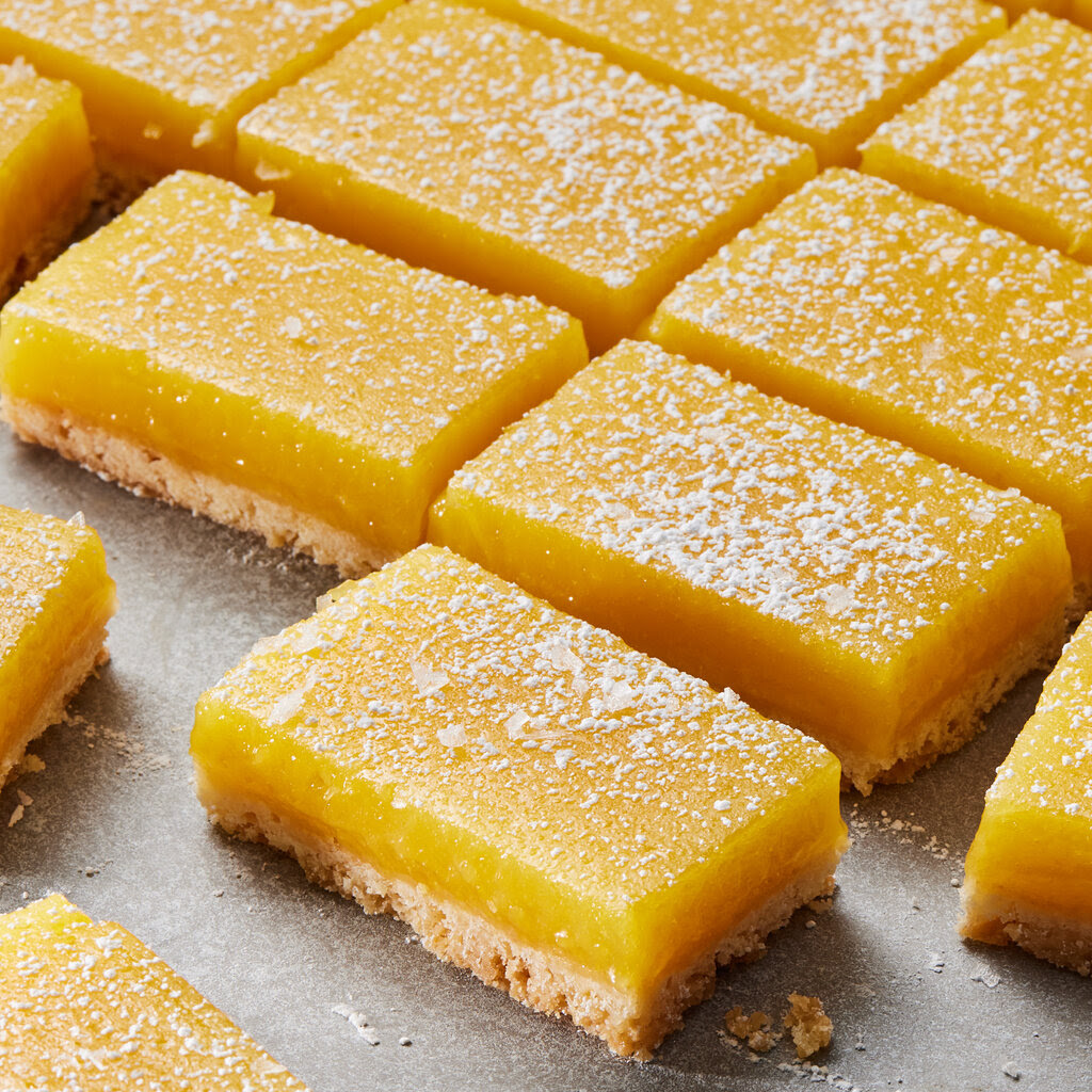 Lemon bars, dusted with fine sugar.