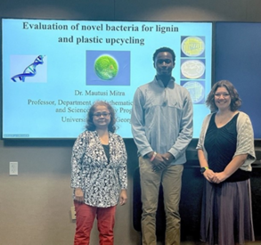 Professor Mautusi Mitra and student Chukwuemeka Okpala with scientist Carrie Eckert