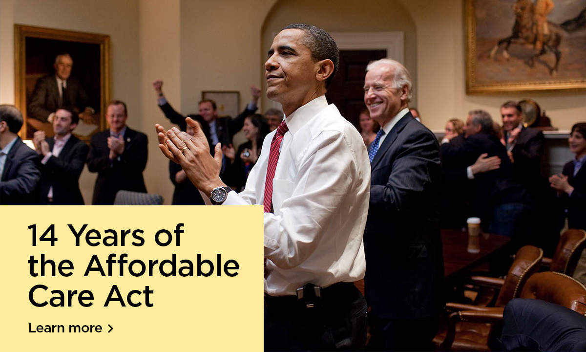 President Obama and then Vice President Biden are shown clapping and smiling in a room filled with other people in suits clapping and hugging. In the bottom right corner, "14 years of the Affordable Care Act, learn more"