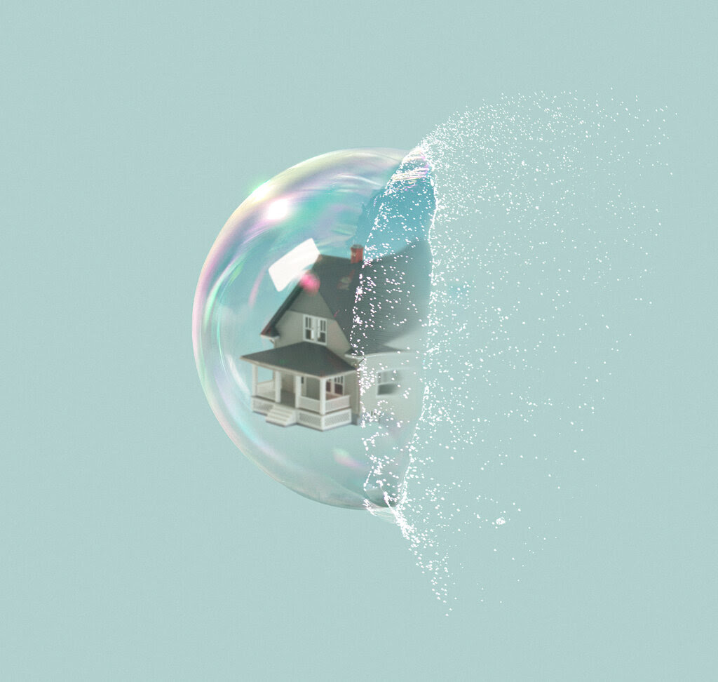 A photo illustration of a two-story house inside a bubble that is popping. 