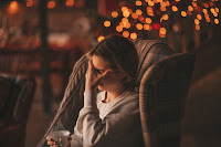 A person crying on a chair during holidays