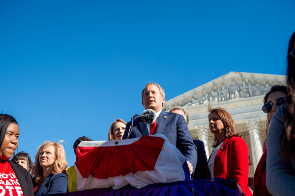 A person speaking at a podium