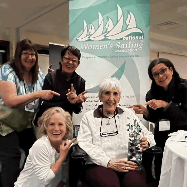 Gail Hine (center, seated) joined the Women's Sailing Foundation board and served NWSA as the editior of Take the Helm for 20 years. She retired as a emertia member of the board in 2021. This photo was taken at Gail's Sailing Convention for Women, April 2023 with NWSA directors in attendance. 